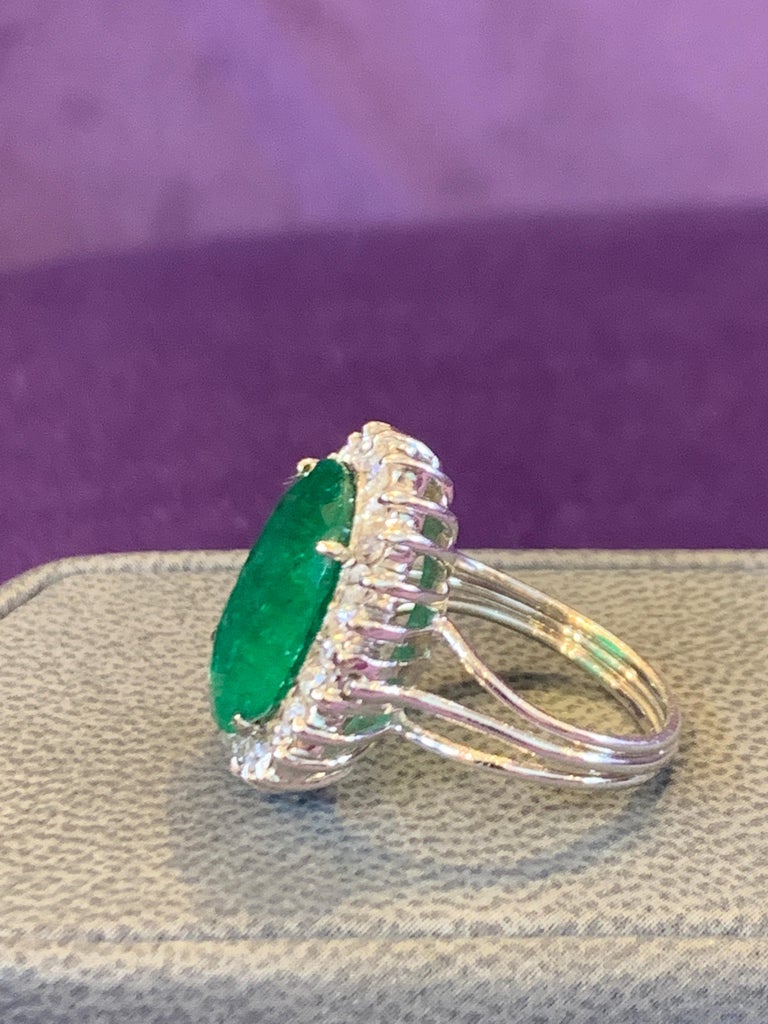 Oval Shaped Emerald & Diamond Halo Ring